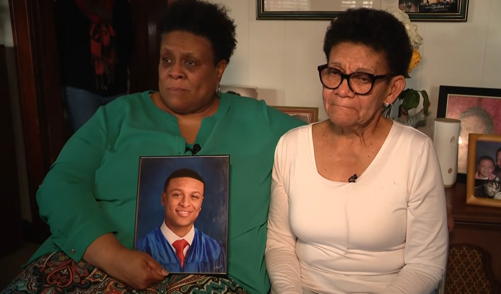 Tyler Simmons' mother, Cheryl Simmons, holds a photo of her son after his death was confirmed on March 13, 2026.
